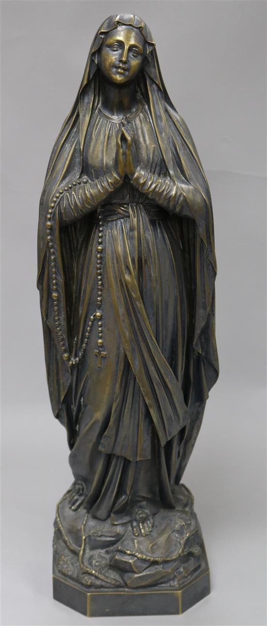 An early 20th century French silvered bronze model of Saint Bernadette, inscribed Casciani et Nau H.51cm.